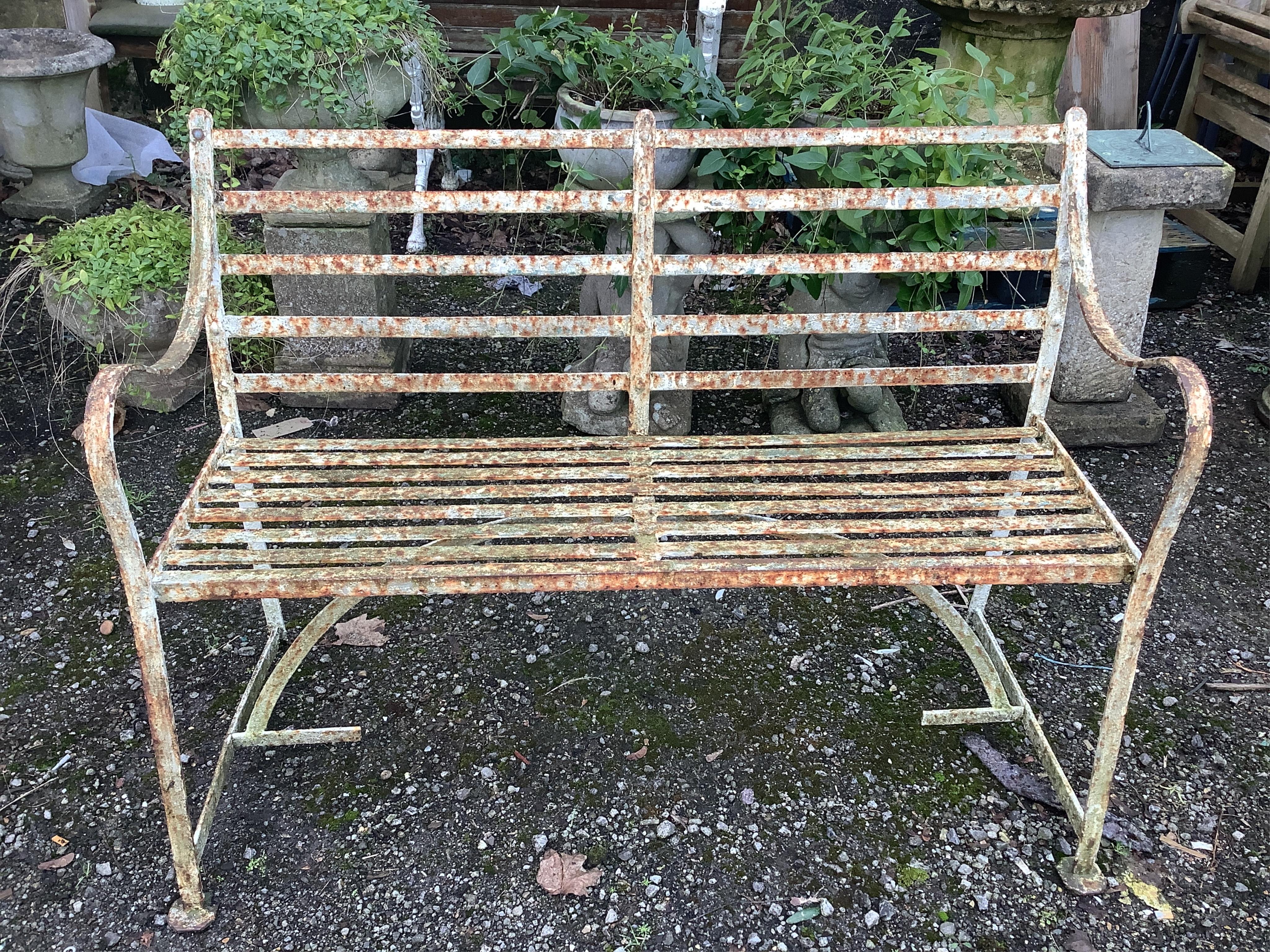 A 19th century white painted slatted wrought iron garden bench, width 122cm, depth 45cm, height 88cm. Condition - poor to fair